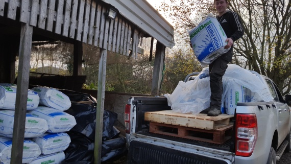 Jon-Paul helping unload HorseHage and Mollichaff for flooded village.